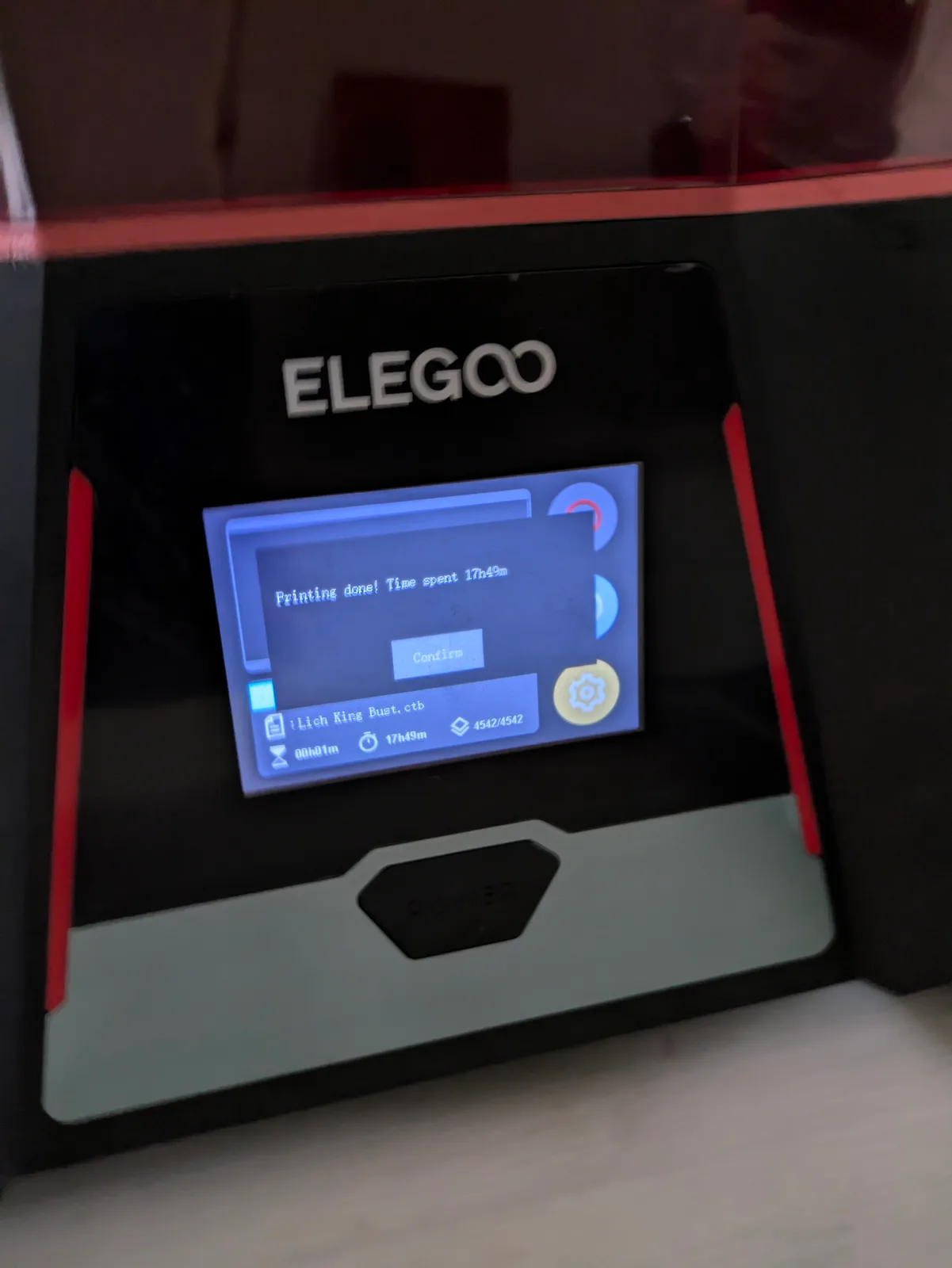 Close-up of an Elegoo printer touchscreen showing Printing done! Time spent 17h49m completion notification with the file Lich King Bust.ctb and 4542 of 4542 layers complete