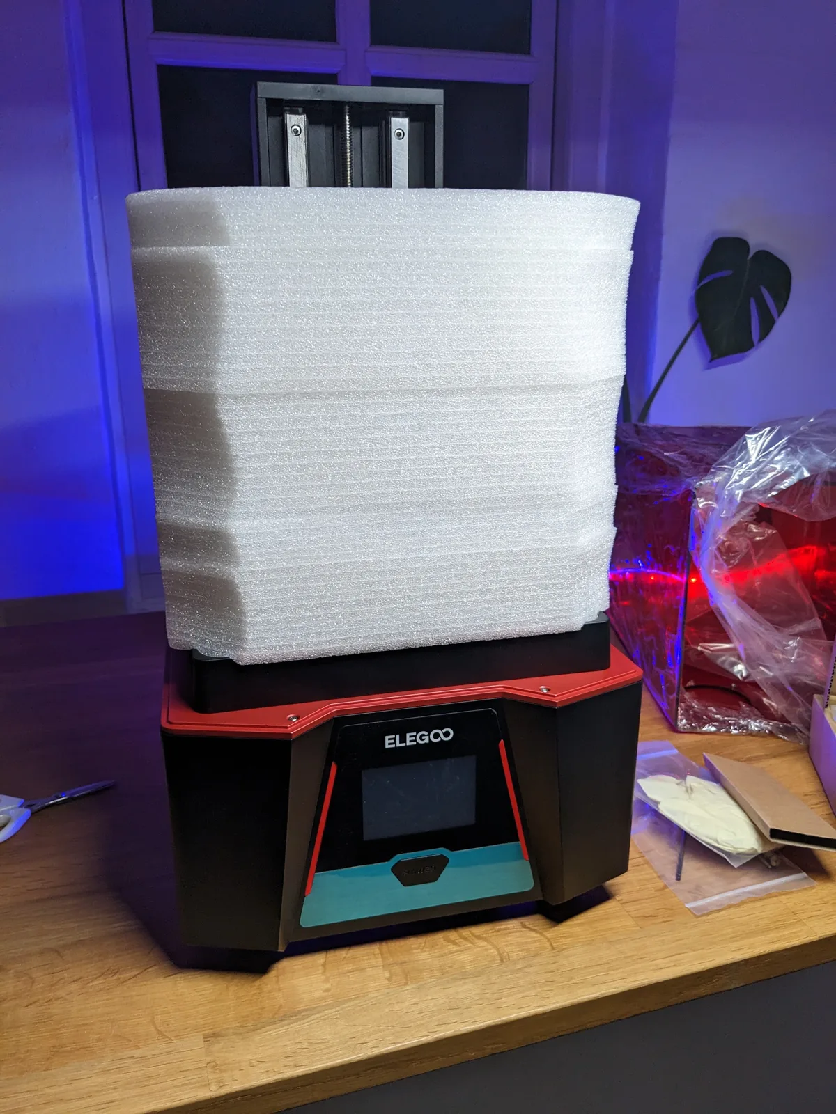 Elegoo Saturn 2 on a workbench wrapped in foam packaging, stored and not in use