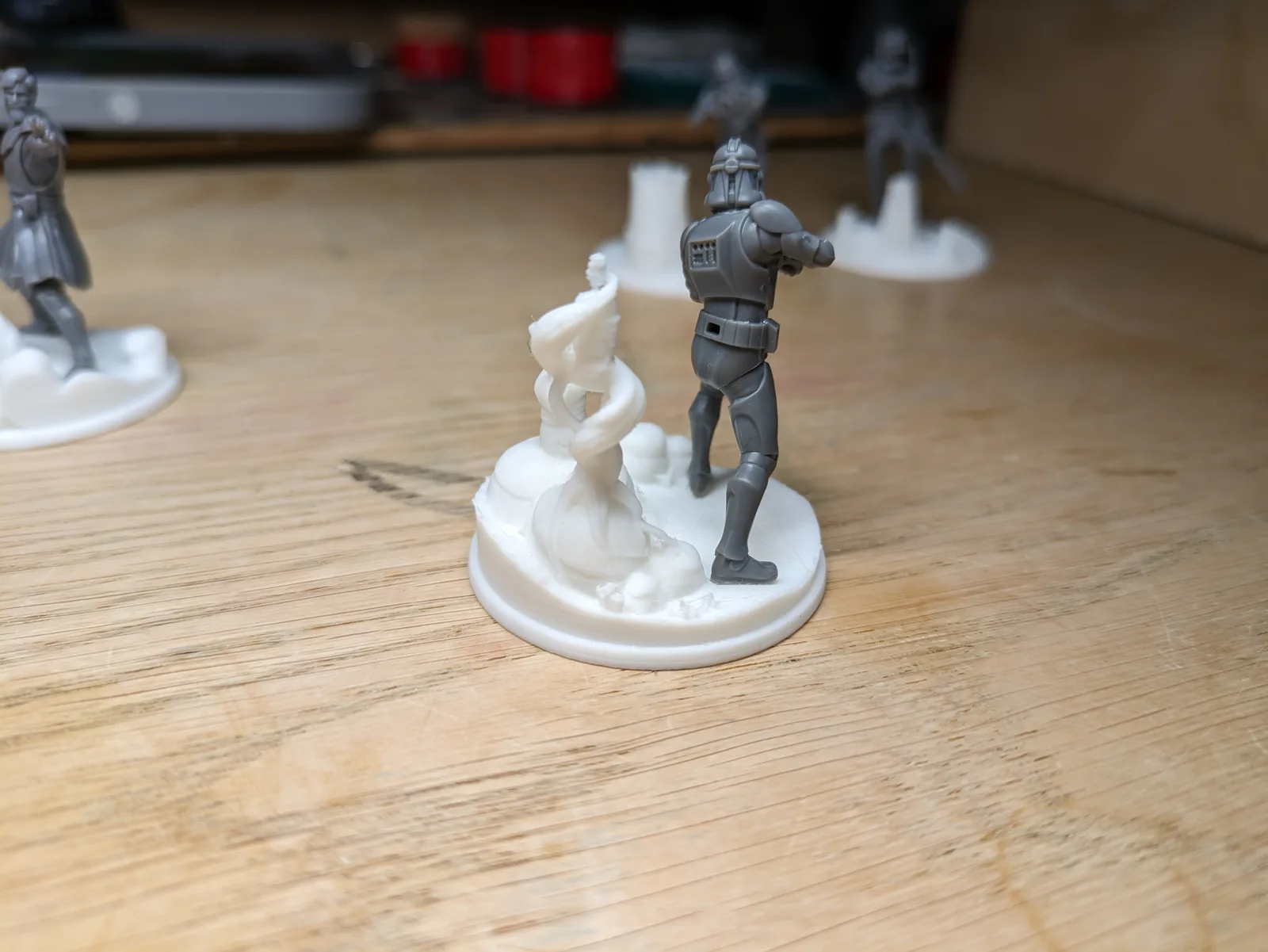 Resin Star Wars stormtrooper miniature mounted on a white FDM-printed scenic snow base